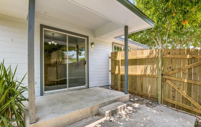 Out back, enjoy a yard for the dogs to run and play, while grilling on your back porch. I can smell the BBQ already! - 2066 Bentwood Dr