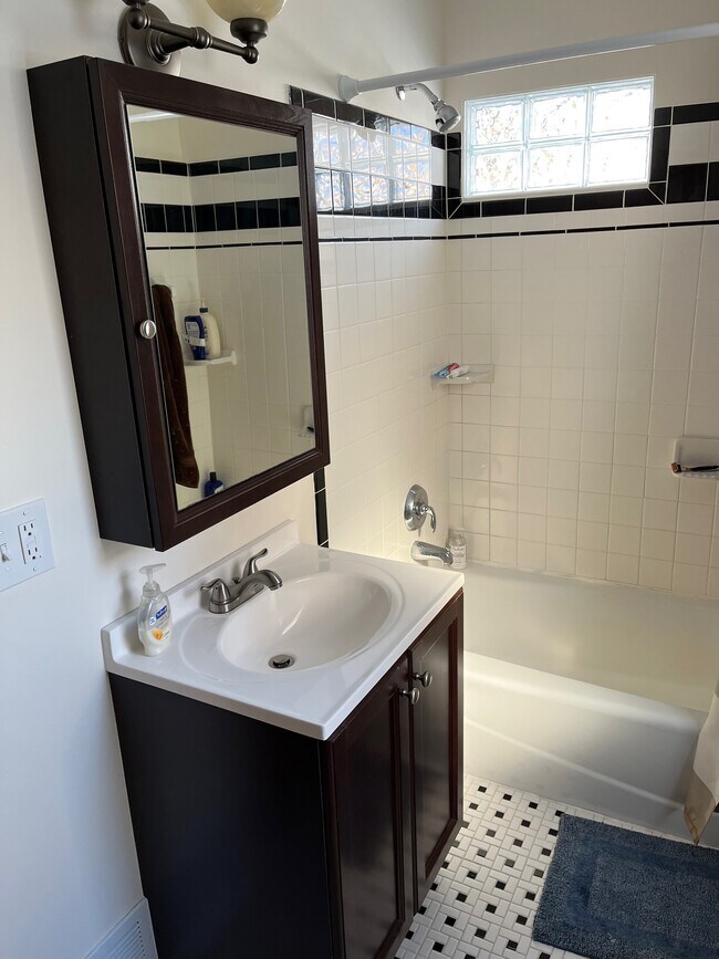 Lavatory, all tile shower - 215 Custer Ave