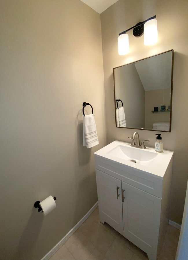 downstairs half bath - 7408 Sandy Creek Dr