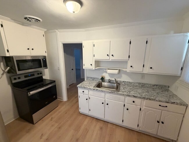 Building Photo - Updated 3 bedroom home with large front porch