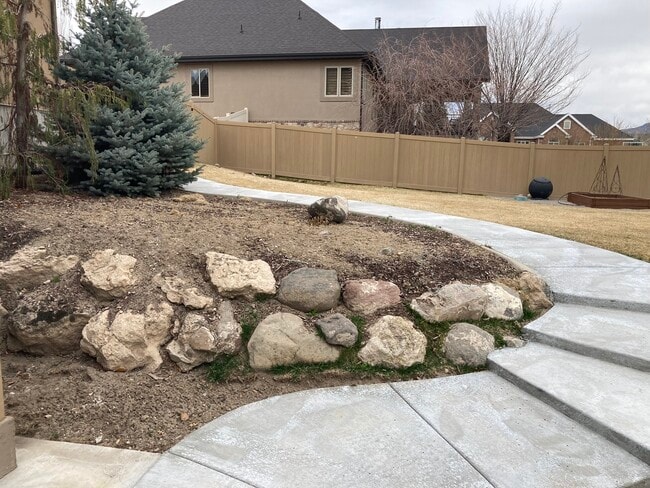 Private side entrance and lighted walkway to gated 1/2 acre yard - 404 N 1060 W