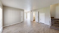 Located at 150 Shady Arbors Cir in Houma, Louisiana, this two-story home offers a functional and well-organized layout across two floors. The main level hosts the living room, which features light wood-style laminate flooring, neutral gray-toned walls, and a large window that allows natural light to fill the space. The open, clean aesthetic carries throughout the home, creating a consistent and cohesive feel.

Upstairs, the two bedrooms are each appointed with the same light wood-style flooring and ceiling fans with integrated lighting, providing both comfort and practicality. The primary bedroom includes a built-in closet, offering convenient storage. The secondary bedroom also features a ceiling fan and a window with outdoor views, adding a bright and airy quality to the room.

The home includes three bathrooms, one of which features a granite-topped vanity with white cabinetry and a bathtub-shower combination. The bathrooms maintain the same neutral, clean design language found throughout the rest of the home.

A staircase connects the two floors, and the overall layout makes efficient use of the available space. Light wood flooring, neutral walls, and ceiling fans in key rooms define the home's straightforward, move-in-ready character.