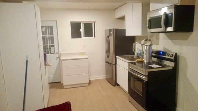 Kitchen with all new appliances - 690 W 8th St