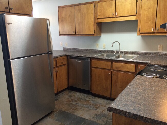 Kitchen with stainless steel appliances. - 815 W Brevard St