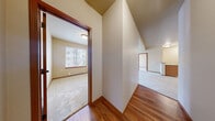 Located at 1201 E Helena Ave in Ellensburg, WA, this 2-bedroom, 2-bathroom single-floor residence offers a functional and well-appointed layout. The open-concept kitchen and living area serves as the heart of the home, with warm hardwood-style flooring underfoot. The kitchen features honey-toned wood cabinetry, tile backsplash, ample counter space, and white appliances including a refrigerator, electric range, dishwasher, and microwave. The spacious living area is bathed in natural light and flows seamlessly into the rest of the unit. Both bedrooms are finished with plush wall-to-wall carpeting and are served by baseboard heating. Each bedroom benefits from good-sized windows that let in natural light, and the primary bedroom includes a closet with built-in shelving. Three closets in total provide generous storage throughout. The two bathrooms are finished with tile flooring, warm wood vanities, neutral countertops, and mirrored medicine cabinets. A dedicated laundry area adds everyday convenience. Warm beige tones, wood trim accents, and a cohesive neutral palette give the space a clean, inviting ambiance throughout.