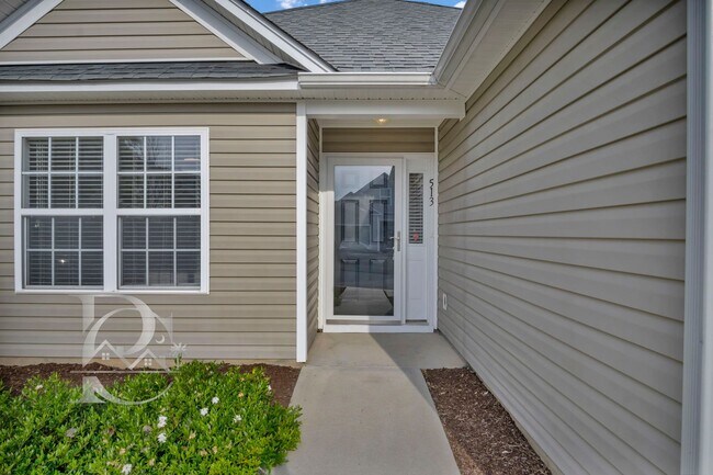 Building Photo - TWO BEDROOM GARDEN HOME IN GATED COMMUNITY