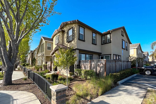 Groups of Craftsman-style homes dot the East Palo Alto neighborhood.