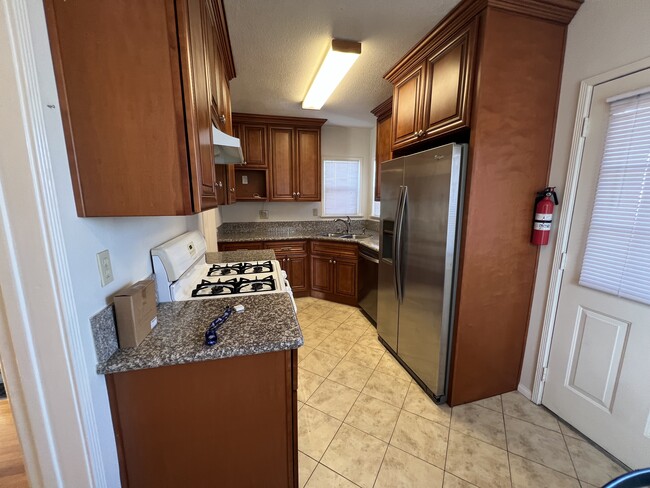 Remodeled kitchen with stainless appliances - 4711 Clark Ave