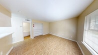 This 380 square foot apartment in Houston, TX offers a compact yet functional living space. The single-story layout comprises four distinct areas, each designed for efficiency. The main living area features warm-toned parquet flooring, creating a welcoming atmosphere. Built-in shelving units provide ample storage without compromising floor space.

The kitchenette, while compact, is strategically placed to maximize utility. The bathroom is divided into two sections: a separate toilet area for privacy, and a main bathroom featuring a single sink vanity and a shower/tub combination. White tiles line the bathroom walls, contributing to a clean, bright appearance.

Large windows in the main living area allow natural light to flood the space, enhancing the sense of openness. The neutral color palette, predominantly white walls with subtle beige accents, further amplifies the brightness and creates an illusion of more space.

Despite its small footprint, the apartment's layout demonstrates thoughtful design, making efficient use of every square foot. The space is ideal for single occupants or couples seeking a low-maintenance, centrally-located residence in Houston.