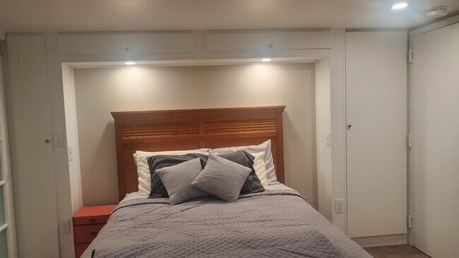 Custom Cabinets around the bed - 3435 203rd St