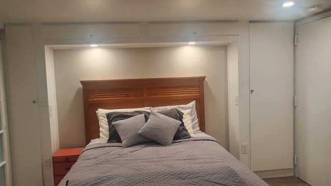 Custom Cabinets around the bed - 3435 203rd St