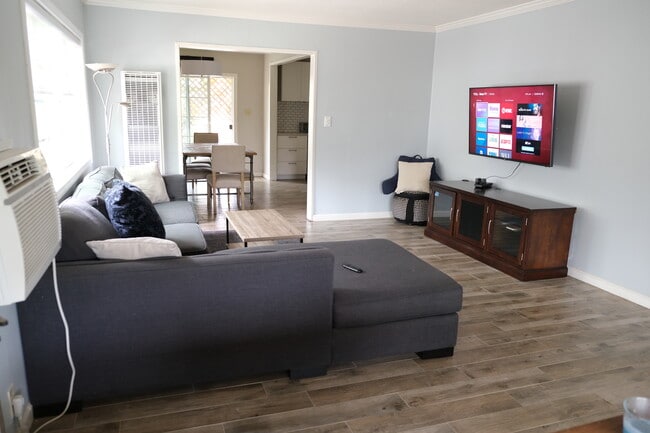 Living room with large smart TV - 1243 N Alexandria Ave