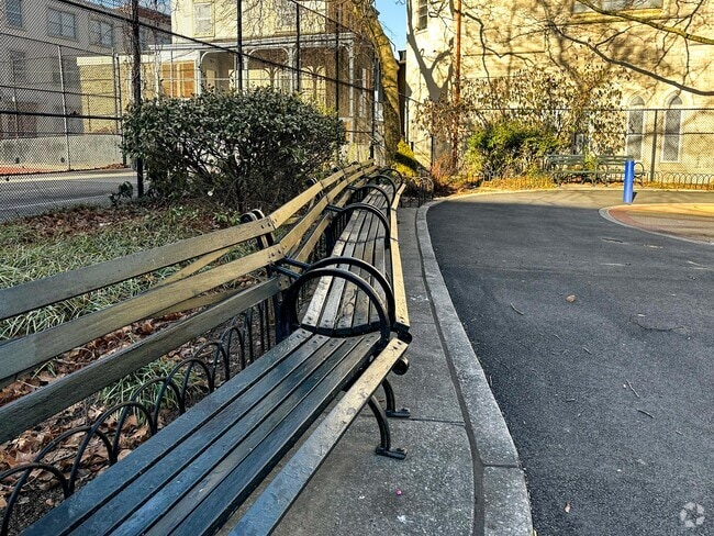 Seating benches line the perimeter of much of Claremont Park in the Claremont neighborhood.
