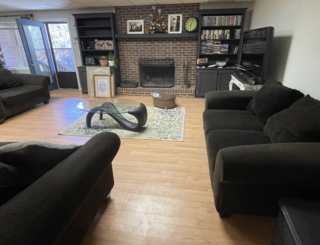 Living Room , Fireplace and Book shelves stocked with movies - 1253 Davis Rd W