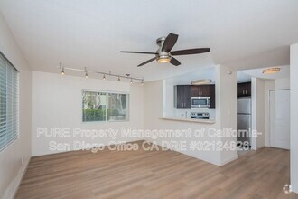 Building Photo - 7565 Charmant Dr