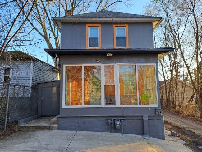 Back part of the house where the parking spaces are located. Left is the storage or shed. - 714 Brook St