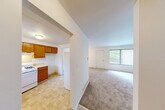 Located at 1300 Hillside Rd in Albion, Michigan, this two-bedroom, one-bathroom home spans three floors, offering a well-organized and functional layout. The main level features a welcoming entrance that opens into a combined living and dining area, finished with neutral carpet and bright white walls. A large window with vertical blinds fills the space with natural light, creating an airy and open atmosphere. The kitchen is equipped with warm wood cabinetry, a gas range, double sink, and tile flooring, with a window overlooking the outdoors. A door from the kitchen provides convenient access to additional areas of the home. The upper level hosts two bedrooms, including a generously sized primary bedroom with a ceiling fan, carpet flooring, and a sliding double-door closet for ample storage. The full bathroom features a clean, white tub-shower surround with chrome fixtures. Throughout the home, five closets provide excellent storage capacity. The basement level offers an open, unfinished utility space with painted concrete floors, housing the mechanical systems including the furnace and water heater, along with a utility sink — presenting potential for additional storage or future use. Staircases connect all three levels efficiently, completing this practical and comfortable home.
