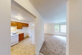 Located at 1300 Hillside Rd in Albion, Michigan, this two-bedroom, one-bathroom home spans three floors, offering a well-organized and functional layout. The main level features a welcoming entrance that opens into a combined living and dining area, finished with neutral carpet and bright white walls. A large window with vertical blinds fills the space with natural light, creating an airy and open atmosphere. The kitchen is equipped with warm wood cabinetry, a gas range, double sink, and tile flooring, with a window overlooking the outdoors. A door from the kitchen provides convenient access to additional areas of the home. The upper level hosts two bedrooms, including a generously sized primary bedroom with a ceiling fan, carpet flooring, and a sliding double-door closet for ample storage. The full bathroom features a clean, white tub-shower surround with chrome fixtures. Throughout the home, five closets provide excellent storage capacity. The basement level offers an open, unfinished utility space with painted concrete floors, housing the mechanical systems including the furnace and water heater, along with a utility sink — presenting potential for additional storage or future use. Staircases connect all three levels efficiently, completing this practical and comfortable home.