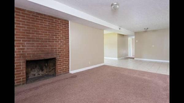 Living and dining room. Hallway to bedrooms - 909 Tipton Station Rd