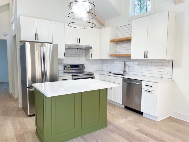 Kitchen with brand new appliances and Eat-in Island with microwave, ready for stools - 1216 Forrest Ave
