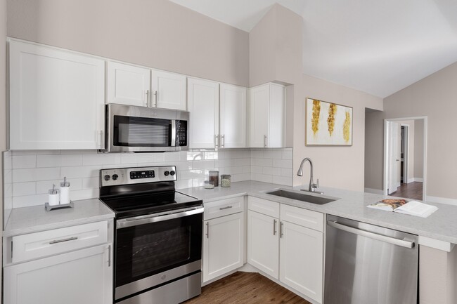 Kitchen with stainless-steel appliances at The Links at Plum Creek in Castle Rock, CO - The Links at Plum Creek