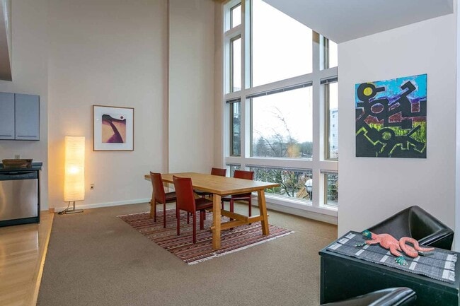 Building Photo - Gorgeous loft-style 2 floor condo with secured parking, A/C and rent includes most utilities!