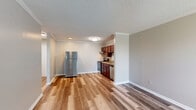 Located at 601 N Dupont Ave in Nashville, TN, this well-organized one-bedroom, one-bathroom unit offers a practical and comfortable single-floor layout. The open-concept living and dining area is finished with warm wood-look laminate flooring, crown molding, and a textured ceiling, creating a clean and inviting atmosphere. A wall-mounted HVAC unit provides climate control, and a window allows natural light to brighten the space. The kitchen is efficiently designed with rich dark-wood cabinetry, granite-style countertops, stainless steel appliances including a refrigerator, electric range, and dishwasher, all seamlessly connected to the main living area. A hallway leads to the carpeted bedroom, which features a window with outdoor views, a textured ceiling, and access to two closets offering ample storage. The bathroom is straightforward and functional, featuring a full tub-shower combination with chrome fixtures. Throughout the unit, consistent laminate flooring in the common areas transitions to soft carpet in the bedroom, providing comfort underfoot. The neutral color palette and clean finishes make this a move-in ready space in a convenient Nashville location.