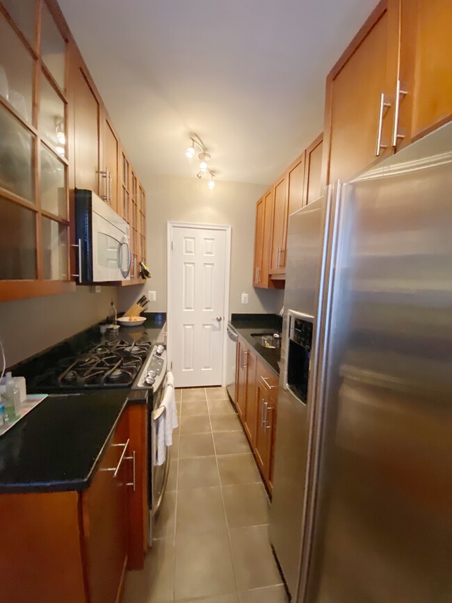 updated kitchen, ample storage - 3010 Wisconsin Ave NW