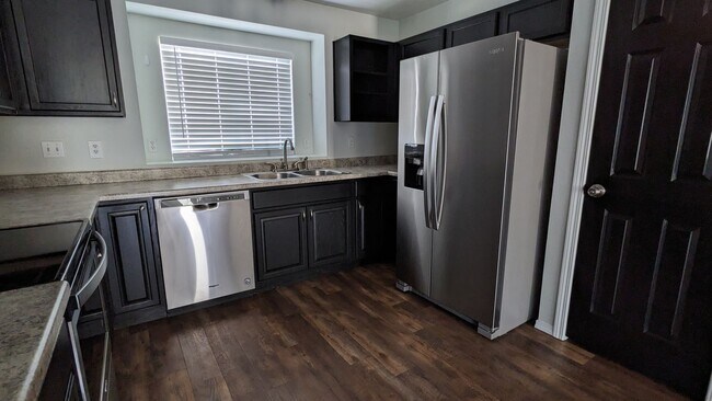 Building Photo - RANCH 4 BED/2 BATH WITH FINISHED BASEMENT AND 2 CAR GARAGE!