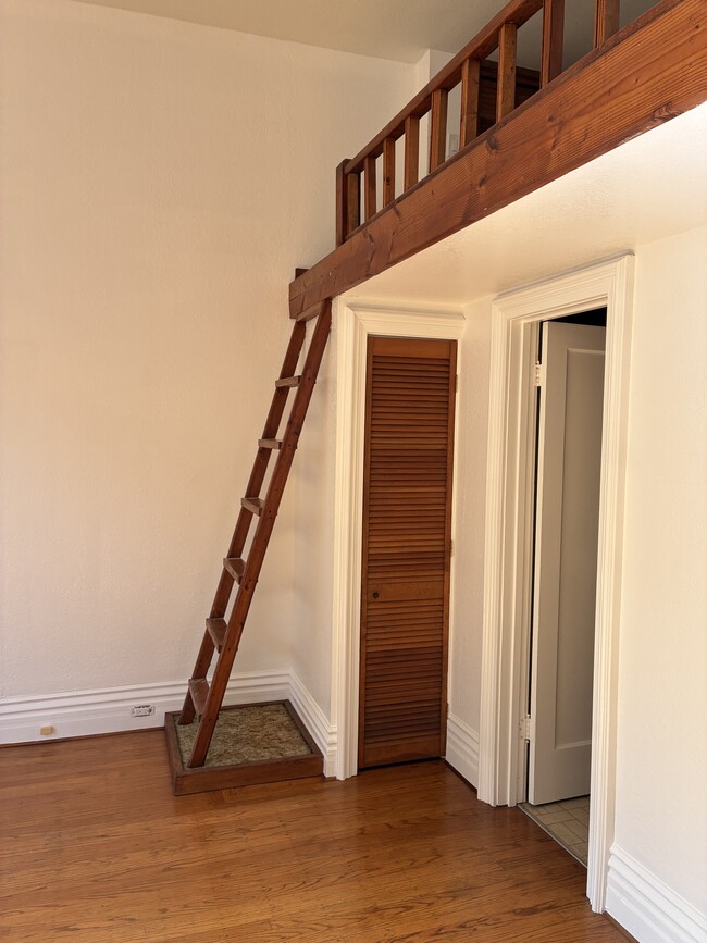 Ladder to loft, storage closet, and door to bathroom - 1516 Third St