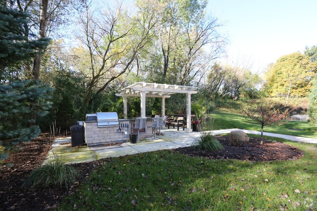 Outdoor kitchen with gas and charcoal grilling areas - Lesilve
