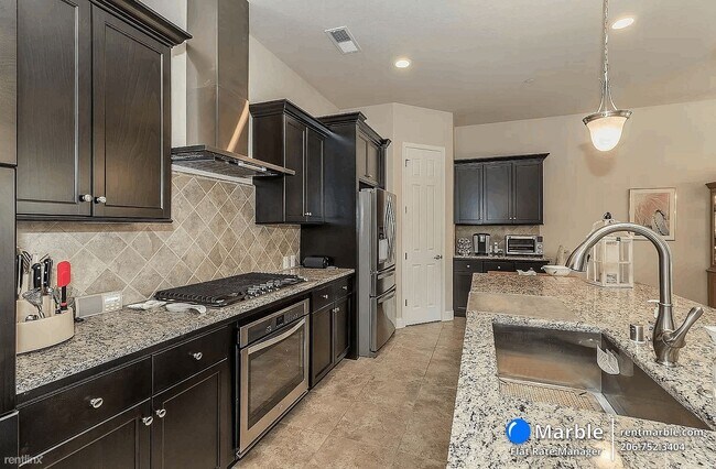 Foto del edificio - 4 br, 2.5 bath House - 6149 E Terrace Ave