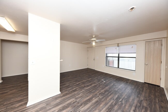 Spacious living room with hardwood-style flooring - Chapel Ridge of Ripley