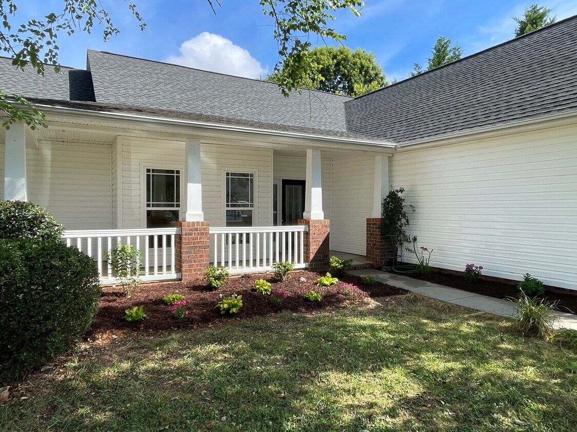 Inviting entry with freshly done landscaping! - 8813 Castle Cliff Dr