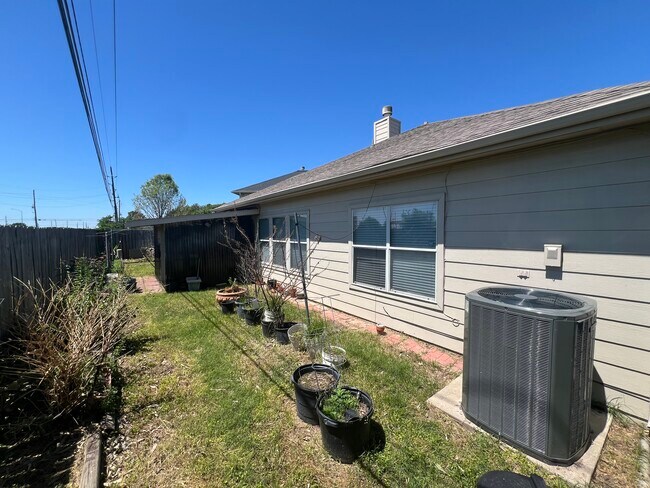 Backyard with greenhouse/patio - 21839 Manitou Falls Ln