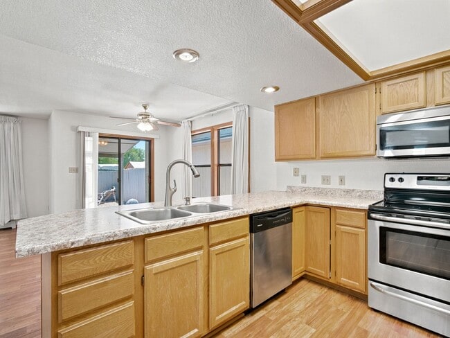 Building Photo - Spacious 2BR Rental with Open Floor Plan & Low-Maintenance yard