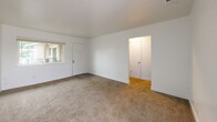 Located at 7337 Power Inn Rd in Sacramento, CA, this single-story unit offers three bedrooms and one bathroom within a compact, efficiently organized floor plan. The interior is finished in a clean, neutral palette throughout, with white walls and light-toned carpeting across the living and bedroom areas, creating a bright and cohesive aesthetic.

The spacious primary bedroom occupies a significant portion of the overall floor plan, providing ample room for furnishings. It features carpeted flooring, white walls, and a window that allows natural light and outdoor views. The two additional bedrooms are similarly finished with carpet and neutral walls; one includes a window with natural light, while another offers a quieter, more enclosed feel. All bedrooms connect through a central hallway that facilitates smooth flow between spaces.

The shared bathroom is well-appointed with a combined shower and bathtub, a white vanity with a speckled stone-look countertop, brushed nickel fixtures and hardware, and wood-look vinyl plank flooring, offering a clean and modern feel. The main living area features carpet flooring and connects to the entry door, with a window providing exterior views and natural light. Overall, the unit presents a clean, move-in-ready interior with consistent finishes throughout.