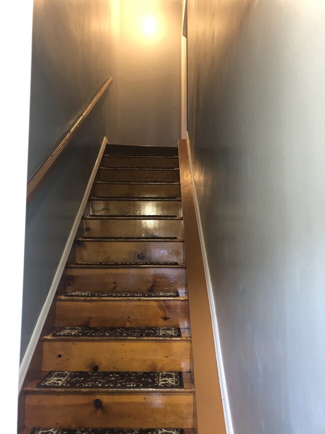 Stair well to 2nd floor apartment - 2593 Pitkin Ave