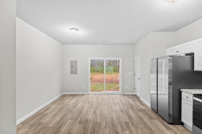 Building Photo - 50% off the first months rent if a lease is signed by 1/15