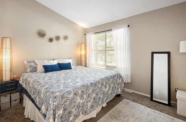 Bedroom 1 with bathroom - 10587 W Maplewood Dr Townhome