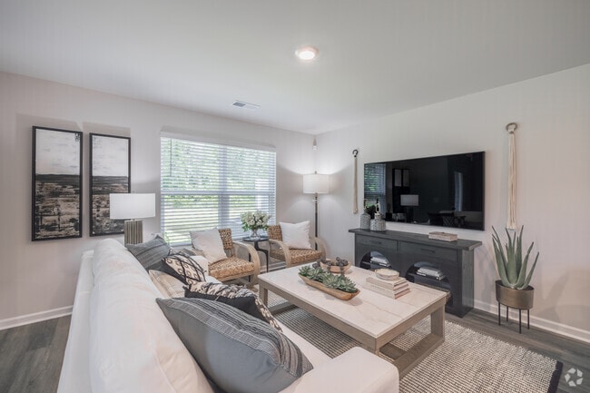 3BR, 2.5BA - 1,418SF - Living Room - The Townes at Amber Bluff