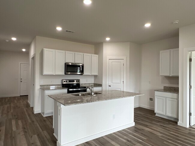 Lots of cabinet space and a good sized pantry! - 306 NW Pinwheel St