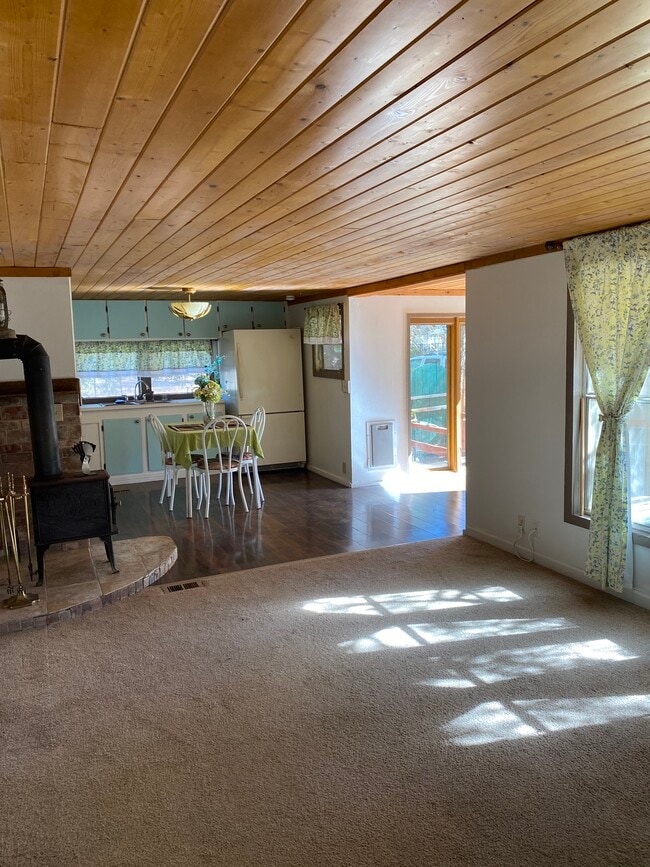 Living Room and Wood Stove - 808 N Easy St