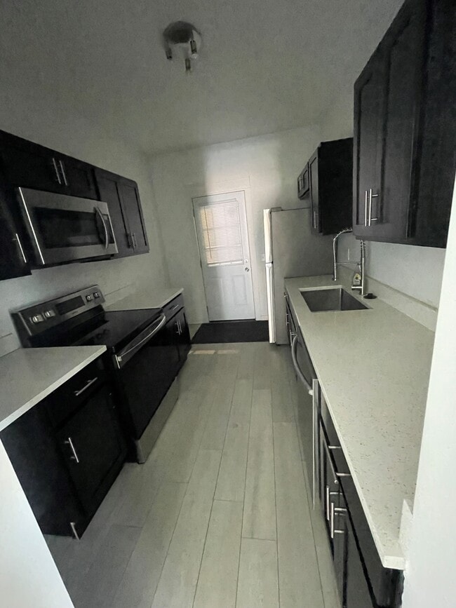 New Kitchen - 11915 Ashbury Ave Apartments