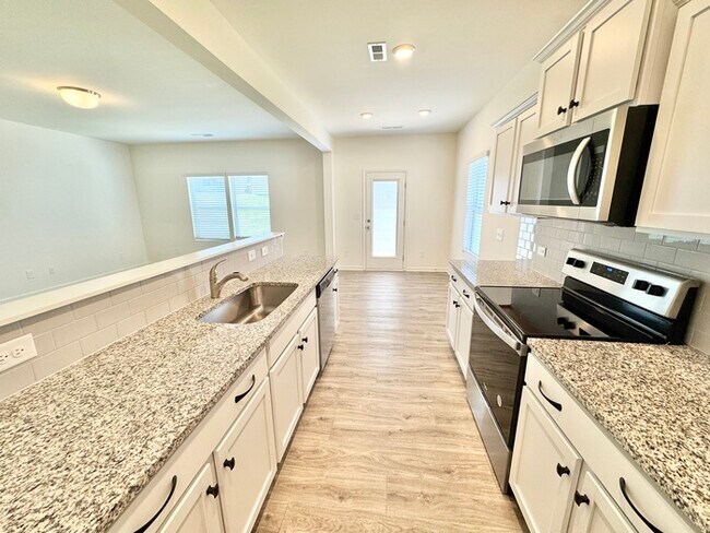 Building Photo - Three bedroom 2 1/2 bath paired home. Clos...