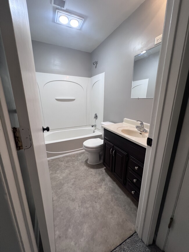 Bathroom with vanity sink and full shower - 220 3rd Ave SW
