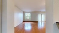 This 820 square foot apartment at Ridge At Blue Hills offers a harmonious blend of comfort and functionality. The single-floor layout encompasses one bedroom, one bathroom, a kitchen, and a living room, creating an ideal space for individuals or couples.

The living area showcases gleaming hardwood floors and large windows that flood the space with natural light, providing a warm and inviting atmosphere. An elegant ceiling fan adds both style and comfort to the room. The open-concept design seamlessly connects the living area to the kitchen, enhancing the sense of spaciousness.

The kitchen boasts modern stainless steel appliances, including a refrigerator and microwave. Wooden cabinetry in a light finish complements the overall design, while a breakfast bar with a granite countertop offers additional dining space and separates the kitchen from the living area.

The bedroom features plush carpeting for comfort underfoot and a large window that allows ample natural light. The bathroom is well-appointed with a combination bathtub and shower, a single vanity with storage, and a large mirror. Slate-like floor tiles add a touch of sophistication to the space.

Throughout the apartment, neutral-toned walls provide a blank canvas for personal decorating styles. The property's thoughtful design maximizes the use of space, creating a comfortable and efficient living environment within its 820 square feet.