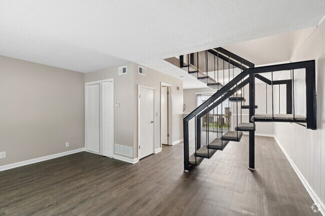 2 habitaciones, 1,5 baños - 1350 pies cuadrados - Sala de estar - London Trace Townhomes