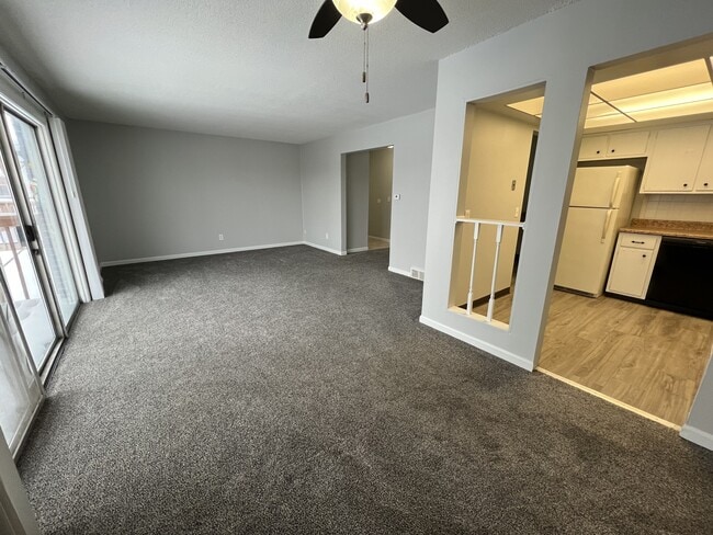2BR, 1.5BA - 1055SF - Living Room and Dining Room - Fountainview East Apartments