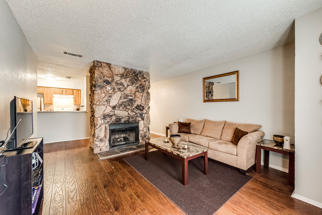 Living Room with fire place - Trinity Court Condominiums